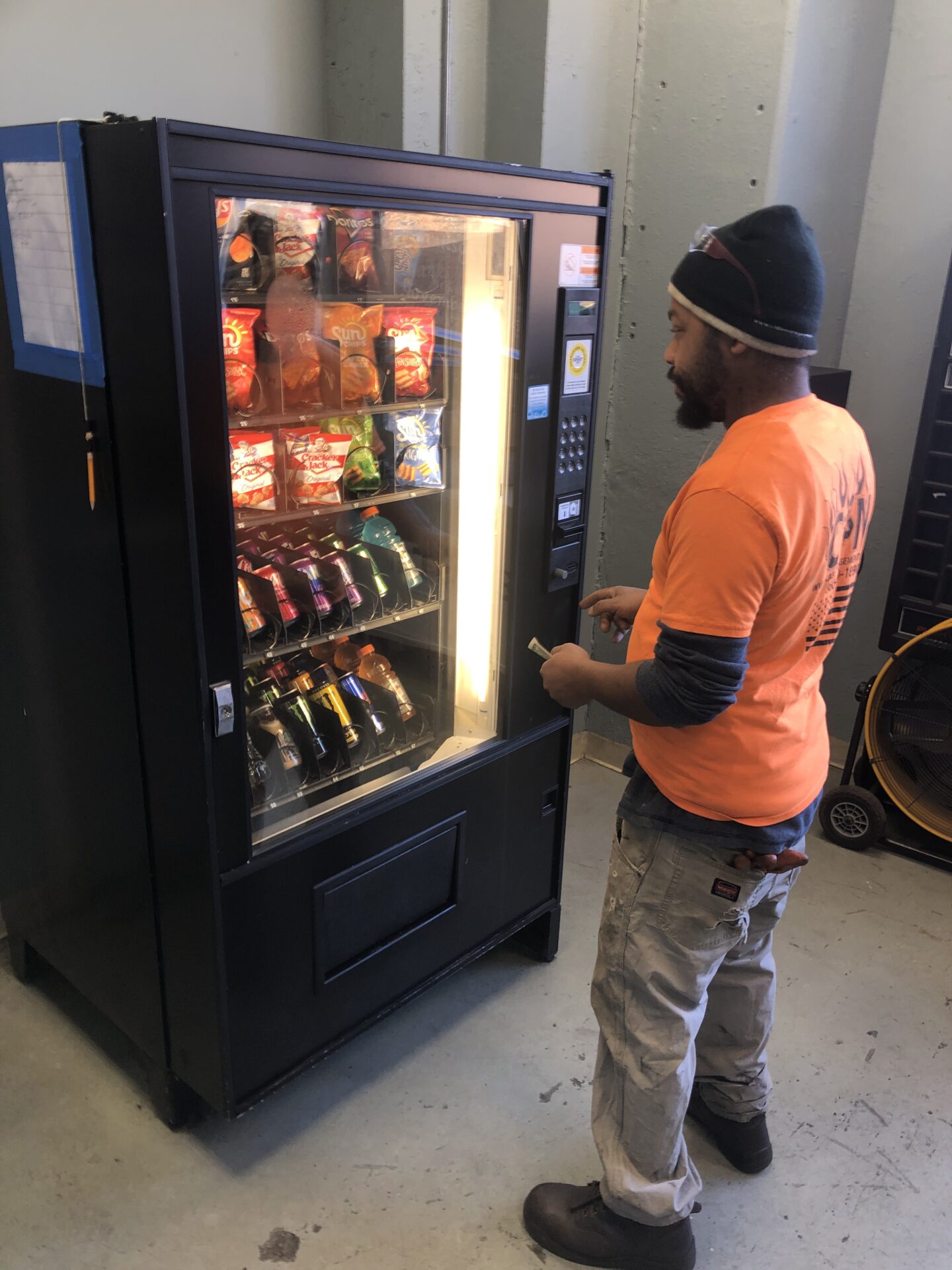 A Man Accessing The Vending machines